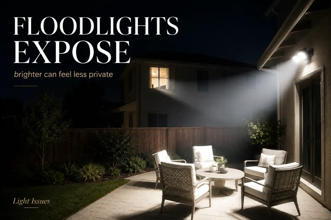 Floodlight exposing a backyard patio and spilling toward a neighbor’s bedroom window, showing why floodlights are bad for backyard privacy.